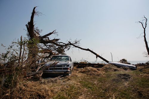 PHIL HOSSACK / WINNIPEG FREE PRESS -   A battered pick up rests at the base of a storm torn tree along side an overturned Sea-Doo at Margaret Bruce Beach on Lake Manitoba Wednesday.  See story. - August 8, 2018