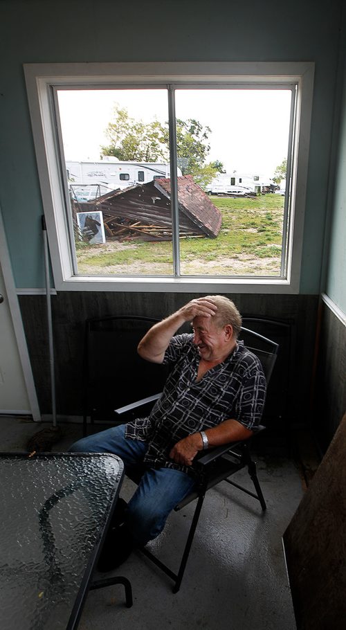 PHIL HOSSACK / WINNIPEG FREE PRESS -  Sitting in the Margaret Bruce Beach office and campground store with the wreckage of a camper over his right shoulder Tuesday, Jimmy Bruce laughs at himself in hindsight for staying in the structure as a tornado destroyed the family campground Friday. See story. - August 7, 2018