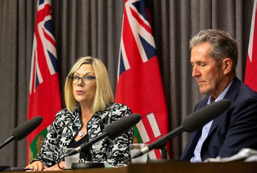 ANDREW RYAN / WINNIPEG FREE PRESS Manitoba Premier Brian Pallister, right, listens as Sustainable Development Minister Rochelle Squires discusses a recent report detailing workplace sexual harassment and measures taken to mitigate it in government at the Manitoba Legislature building press room on August 9, 2018.