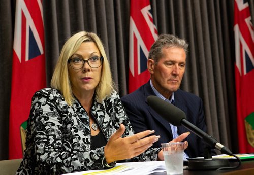 ANDREW RYAN / WINNIPEG FREE PRESS Manitoba Premier Brian Pallister, right, listens as Sustainable Development Minister Rochelle Squires discusses a recent report detailing workplace sexual harassment and measures taken to mitigate it in government at the Manitoba Legislature building press room on August 9, 2018.