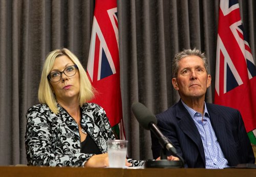 ANDREW RYAN / WINNIPEG FREE PRESS Manitoba Premier Brian Pallister, right, and Sustainable Development Minister Rochelle Squires listen to a question from a reporter regarding a recent report detailing workplace sexual harassment and measures taken to mitigate it in government at the Manitoba Legislature building press room on August 9, 2018.