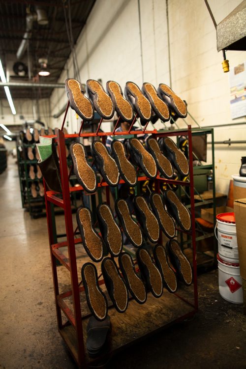 ANDREW RYAN / WINNIPEG FREE PRESS A rack of partially completed boots with distinct cork soles on the assembly line of the Canada West Boots manufacturing centre on August 9, 2018. The pleated sole is something which sets the company apart in terms of quality.