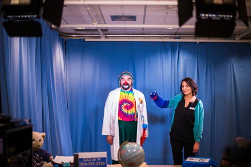 MIKAELA MACKENZIE / WINNIPEG FREE PRESS
David Langdon, therapeutic clown, poses for portraits as Onri with puppet Noname and child life specialist Maria Soroka at The Good Day Show studio at the Children's Hospital in Winnipeg on Wednesday, Aug. 8, 2018. The daily live show has been running for over 30 years exclusively for the dozens of kids staying at the facility.
Winnipeg Free Press 2018.