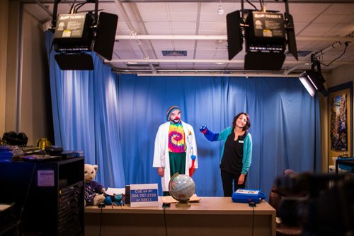 MIKAELA MACKENZIE / WINNIPEG FREE PRESS
David Langdon, therapeutic clown, poses for portraits as Onri with puppet Noname and child life specialist Maria Soroka at The Good Day Show studio at the Children's Hospital in Winnipeg on Wednesday, Aug. 8, 2018. The daily live show has been running for over 30 years exclusively for the dozens of kids staying at the facility.
Winnipeg Free Press 2018.