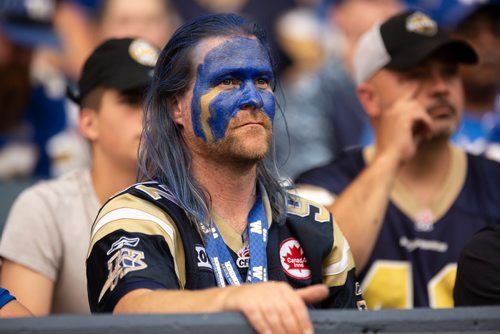 ANDREW RYAN / WINNIPEG FREE PRESS A fan painted in Bombers blue watches the Winnipeg in Bombers action on August 10, 2018.