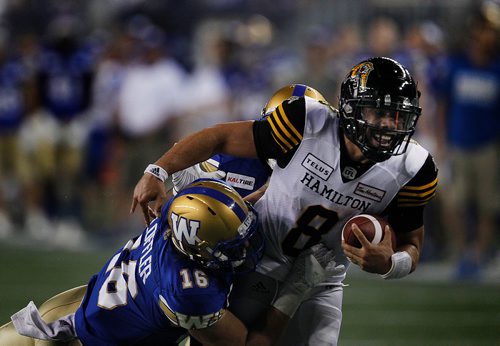 PHIL HOSSACK / WINNIPEG FREE PRESS - Winnipeg Blue Bomber #16 Taylor Loffler takes down  Hamilton's Ti-Cat  #8 Jeremiah Masoli too late as the QB ran for a and scored TD in the 2nd half Friday night at Investor's Group Stadium in Winnipeg. See story. - August 10, 2018