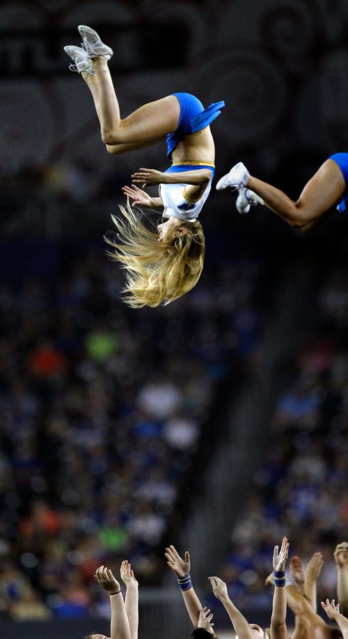 PHIL HOSSACK / WINNIPEG FREE PRESS - A flying Winnipeg Blue Bomber dance team Friday night at Investor's Group Stadium in Winnipeg. See story. - August 10, 2018