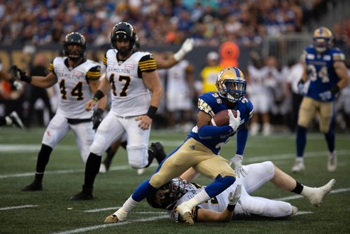 ANDREW RYAN / WINNIPEG FREE PRESS Marcus Sayles (36) gets by Hamilton Tigercats defence in game action on August 10, 2018.