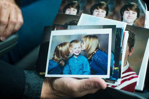 MIKAELA MACKENZIE / WINNIPEG FREE PRESS
John Harris shows family photos of Ben Harris in the R.M. of St. Andrews on Monday, Aug. 13, 2018. 
Winnipeg Free Press 2018.