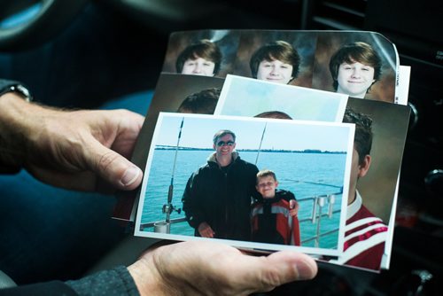 MIKAELA MACKENZIE / WINNIPEG FREE PRESS
John Harris shows family photos of Ben Harris in the R.M. of St. Andrews on Monday, Aug. 13, 2018. 
Winnipeg Free Press 2018.