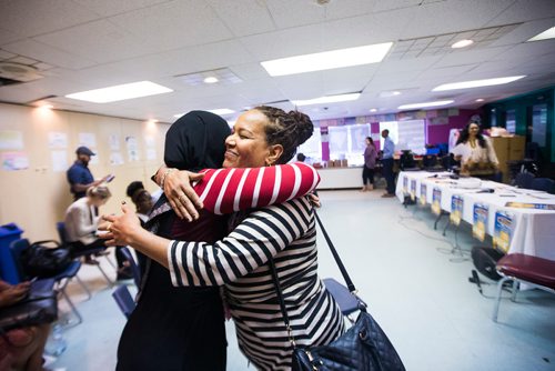 MIKAELA MACKENZIE / WINNIPEG FREE PRESS
Lete Izez (right) hugs Fatuma Sufi before a Newcomer Get Out the Vote campaign launch in Winnipeg on Tuesday, Aug. 14, 2018. 
Winnipeg Free Press 2018.