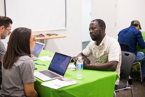 MIKAELA MACKENZIE / WINNIPEG FREE PRESS
Jeremiah Akingbona signs up for Uber Eats at the Millennium Library in Winnipeg on Tuesday, Aug. 14, 2018. 
Winnipeg Free Press 2018.