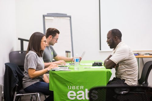 MIKAELA MACKENZIE / WINNIPEG FREE PRESS
Jeremiah Akingbona signs up for Uber Eats at the Millennium Library in Winnipeg on Tuesday, Aug. 14, 2018. 
Winnipeg Free Press 2018.