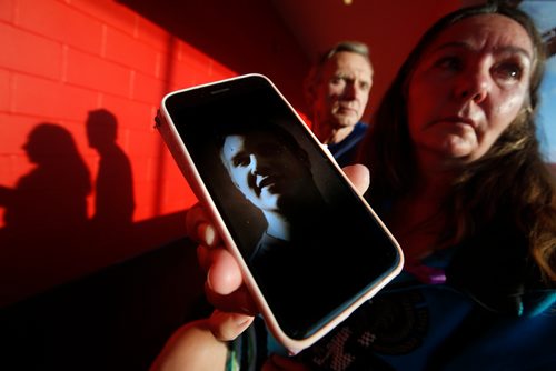 JOHN WOODS / WINNIPEG FREE PRESS
Bruce and Barb Ashley hold a photo of their son Robert, who died of an overdose, as people gathered at an information session for  a new addictions centre in St James  at Sturgeon Creek Community Centre Tuesday, August 14, 2018.