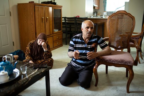 ANDREW RYAN / WINNIPEG FREE PRESS Amina Al Mohammed Al Issa, wipes her eye as she and husband Hasan Alhamid Aldkhalaf speak through a translator to reporter Carol Sanders in their home on August 15, 2018. The Syrian refugees received notice that their son, who is currently in Lebanon, received his notice to serve in the Lebanese military in six months.