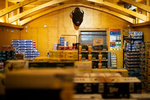 ANDREW RYAN / WINNIPEG FREE PRESS A Manitoba bison head hangs inside the refrigerated room of the Beer Mkt. beer store on August 15, 2018.