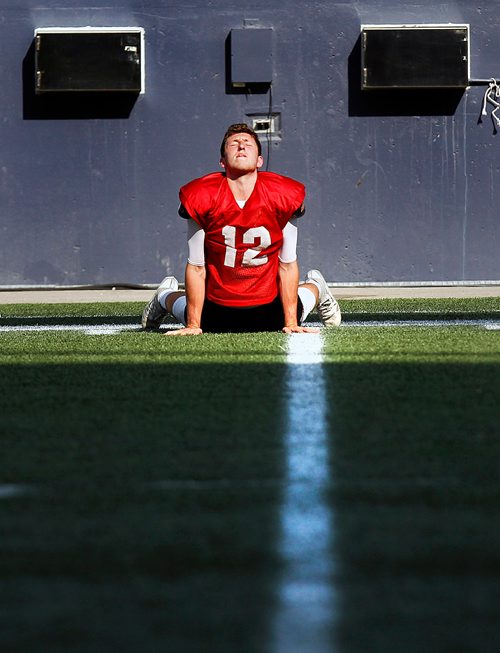 PHIL HOSSACK / WINNIPEG FREE PRESS -Bison QB #12 Des Catellier stretches on the practice field Wednesday. See story.  - August 15, 2018