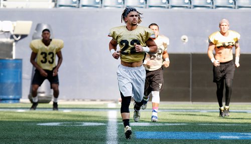 PHIL HOSSACK / WINNIPEG FREE PRESS -Bison Jamel Lyles #22 struts his stuff on the practice field Wednesday. See story.  - August 15, 2018