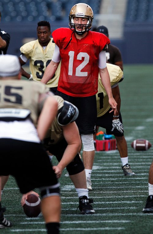 PHIL HOSSACK / WINNIPEG FREE PRESS -Bison QB #12 Des Catellier calls the play on the practice field Wednesday. See story.  - August 15, 2018