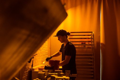 MIKAELA MACKENZIE / WINNIPEG FREE PRESS
Bram Keast prepares screens for printing in the darkroom at the Floodway Print Co. in their new space in the exchange district in Winnipeg on Thursday, Aug. 16, 2018. 
Winnipeg Free Press 2018.