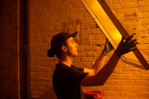 MIKAELA MACKENZIE / WINNIPEG FREE PRESS
Bram Keast prepares screens for printing in the darkroom at the Floodway Print Co. in their new space in the exchange district in Winnipeg on Thursday, Aug. 16, 2018. 
Winnipeg Free Press 2018.