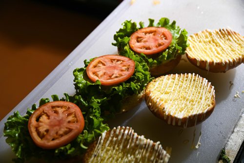 Mike Sudoma / Winnipeg Free Press
Fresh ingredients laid out and waiting for the patty to be added. August 16, 2018. St. James Burger & Chip Co.