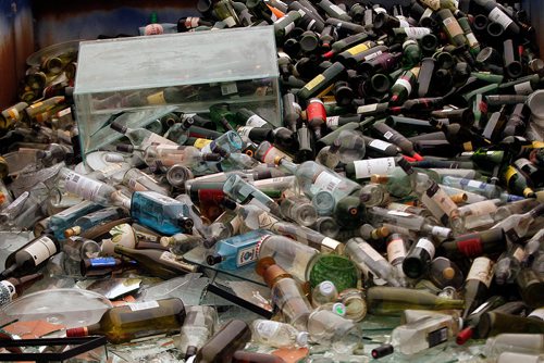 PHIL HOSSACK / WINNIPEG FREE PRESS -  Glass bottles and an aquarium fill a bin at the city's newest 4R Recycling Depot on Panet Road Thursday. See Jill Wilson's story. - August 15, 2018