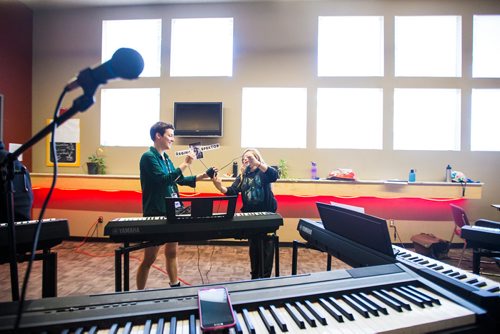 MIKAELA MACKENZIE / WINNIPEG FREE PRESS
Nicole Froese (left) and Adrianna Cardamone set up the keyboards before class at the inaugural Girls Rock Winnipeg, a new day camp in which girls and non-binary youth form a band, write a song, record, and perform in the space of a week, at the West End Cultural Centre in Winnipeg on Wednesday, Aug. 15, 2018. 
Winnipeg Free Press 2018.