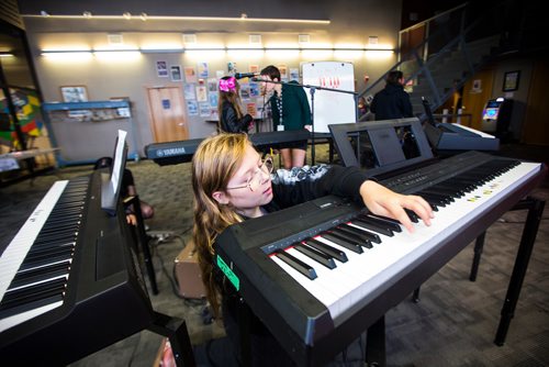 MIKAELA MACKENZIE / WINNIPEG FREE PRESS
Adrianna Cardamone helps set up the keyboards before class at the inaugural Girls Rock Winnipeg, a new day camp in which girls and non-binary youth form a band, write a song, record, and perform in the space of a week, at the West End Cultural Centre in Winnipeg on Wednesday, Aug. 15, 2018. 
Winnipeg Free Press 2018.