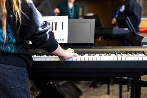 MIKAELA MACKENZIE / WINNIPEG FREE PRESS
Adrianna Cardamone plays chords in the keyboard class at the inaugural Girls Rock Winnipeg, a new day camp in which girls and non-binary youth form a band, write a song, record, and perform in the space of a week, at the West End Cultural Centre in Winnipeg on Wednesday, Aug. 15, 2018. 
Winnipeg Free Press 2018.