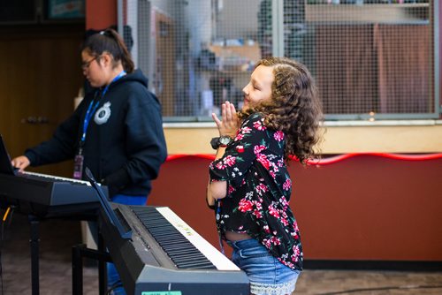 MIKAELA MACKENZIE / WINNIPEG FREE PRESS
Amellie Tara dances during the keyboard class at the inaugural Girls Rock Winnipeg, a new day camp in which girls and non-binary youth form a band, write a song, record, and perform in the space of a week, at the West End Cultural Centre in Winnipeg on Wednesday, Aug. 15, 2018. 
Winnipeg Free Press 2018.