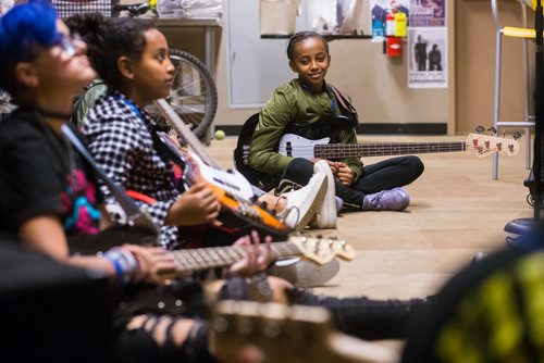 MIKAELA MACKENZIE / WINNIPEG FREE PRESS
Mallani Nabi listens during bass class at the inaugural Girls Rock Winnipeg, a new day camp in which girls and non-binary youth form a band, write a song, record, and perform in the space of a week, at the West End Cultural Centre in Winnipeg on Wednesday, Aug. 15, 2018. 
Winnipeg Free Press 2018.