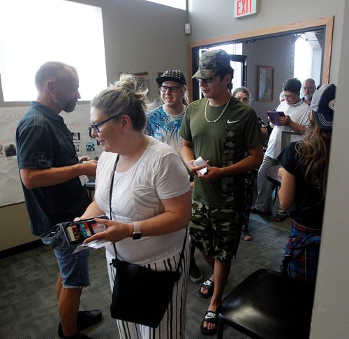 PHIL HOSSACK / WINNIPEG FREE PRESS - Parents and friends arrive at the WECC to hear the girls of "GirlsRock" perform Saturday. See Jenn Zoratti story.  - August 17, 2018