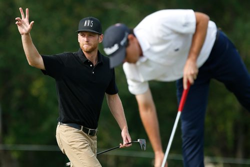 JOHN WOODS / WINNIPEG FREE PRESS
Tyler McCumber waves to the crowd as Drew Weaver reaches for his ball on the 18th at the Players Cup at Southwood Golf and Country Club in Winnipeg Sunday, August 19, 2018.