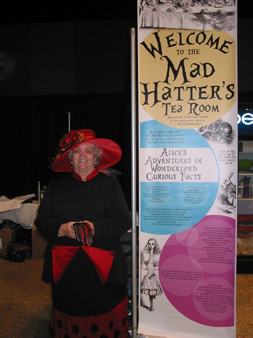Canstar Community News Aug. 13, 2018 - A gracious lady welcomed visitors to the Mat Hatter's tea room at the United Kingdom pavilion. (ANDREA GEASRY/CANSTSAR COMMUNITY NEWS)