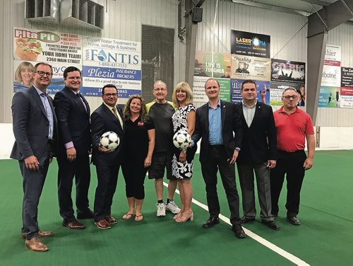 Canstar Community News Local dignitaries joined longtime volunteers to celebrate the announced of over $45,000 in funding for a new soccer pitch at Gateway Recreation Centre (1717 Gateway Rd.) on Aug. 16. (SHELDON BIRNIE/CANSTAR/THE HERALD)