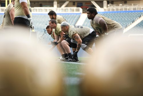 RUTH BONNEVILLE / WINNIPEG FREE PRESS

Sports Bisons

Photo of Bisons left Guard #55 Reid McMorris (centre, white cap),  as he practices with the team at Investors Group Stadium Monday.


August 15/18
