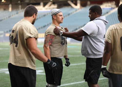 RUTH BONNEVILLE / WINNIPEG FREE PRESS

Sports Bisons

Photo of Bisons  coach, Kelly Butler working with left Guard #55 Reid McMorris and his team on the field at Investors Group Stadium Monday.


August 15/18
