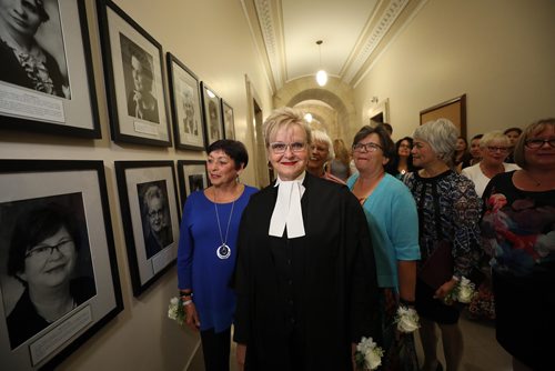 RUTH BONNEVILLE / WINNIPEG FREE PRESS

Standup photo 
Myrna Driedger, Speaker of the Legislative Assembly (Centre, black/white), looks over a group of photos along with other past women members elected as MLA's, at the official unveiling of Women Trailblazers who became members of the MLA in the first 100 years, in the hallway at the Legislative building Tuesday.  

More info:
The special project called You cant be what you cant see. See Her, Be Her was to honour the first 100 years since the passage of legislation granting women the right to vote on January 28, 1916 till January 28th, 2016.  In that time period only 51 women
were elected to the Manitoba Legislative Assembly as MLAs and only a small number have served as Officers of the Legislative Assembly. This wall honours, celebrates and uplifts the achievements of 18 women who were/are in positions traditionally held by men or who have worked to forge new pathways for women.



August 21/18
