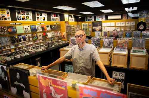 ANDREW RYAN / WINNIPEG FREE PRESS Greg Tonn, owner of Into the Music in Osbourne Village poses for a portrait in his used CD and Vinyl store on August 22, 2018. Tonn said he doesn't plan on abandoning CD sales any time soon.