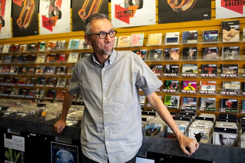 ANDREW RYAN / WINNIPEG FREE PRESS Greg Tonn, owner of Into the Music in Osbourne Village poses for a portrait in his used CD and Vinyl store on August 22, 2018. Tonn said he doesn't plan on abandoning CD sales any time soon.