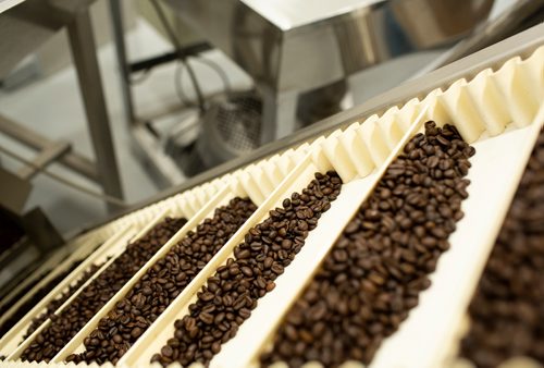 ANDREW RYAN / WINNIPEG FREE PRESS Premeasured doses of DeLuca's roasted espresso beans comes off of the line in their newest location on August 22, 2018.