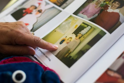 MIKAELA MACKENZIE / WINNIPEG FREE PRESS
Renee Ethans, the former driving force of CHTV for over 20 years, flips through old photo books in her home in Winnipeg on Thursday, Aug. 23, 2018.
Winnipeg Free Press 2018.