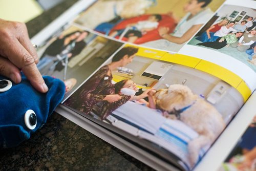 MIKAELA MACKENZIE / WINNIPEG FREE PRESS
Renee Ethans, the former driving force of CHTV for over 20 years, pauses at a picture of Crystal Rondeau while flipping through old photo books in her home in Winnipeg on Thursday, Aug. 23, 2018.
Winnipeg Free Press 2018.