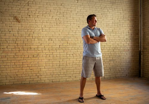 ANDREW RYAN / WINNIPEG FREE PRESS Local entrepreneur Jason Abbott poses for a portrait in the second of his spaces where remote workers can come and use the space for business meetings and work on August 23, 2018. The newest location is located in the Exchange District along Arthur Street.