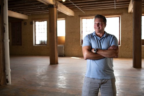 ANDREW RYAN / WINNIPEG FREE PRESS Local entrepreneur Jason Abbott poses for a portrait in the second of his spaces where remote workers can come and use the space for business meetings and work on August 23, 2018. The newest location is located in the Exchange District along Arthur Street.