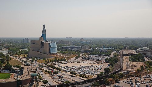 MIKE DEAL / WINNIPEG FREE PRESS
A smokey haze sits on the city's skyline of trees with the Canadian Museum of Human Rights and The Forks.
180823 - Thursday, August 23, 2018.