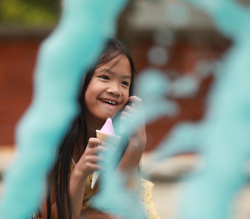 RUTH BONNEVILLE / WINNIPEG FREE PRESS

Eight-year-old Kylie Lange smiles at her mom while eating her pink gelato cone as she checks out the blue fountain water at a small park on Hugo and Jessie Street Thursday afternoon.

The two had just been to Nucci's Gelati enjoying the warm weather and last few days of summer before heading back to school. 

Standup photo 

August 23/18
