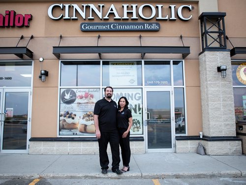 ANDREW RYAN / WINNIPEG FREE PRESS 
Colin and Menchie Finlay stand in front of their Kenaston Common storefront for Cinnaholic. The local entrepreneurial couple will be opening the vegan cinnamon roll joint in September. It is a franchise that started in California a decade ago. Two more locations to follow within a year. For Erik Pindera story. August 23, 2018.