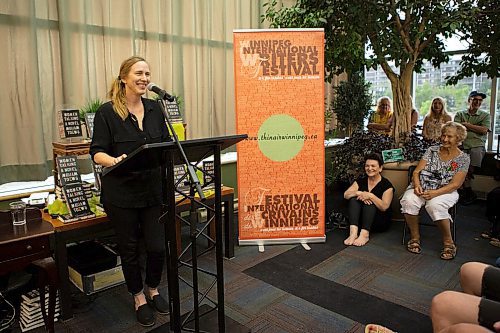 ANDREW RYAN / WINNIPEG FREE PRESS Author Miriam Toews speaks to the crowd of fans before reading from her new book at a packed house at McNally's on August 23, 2018.